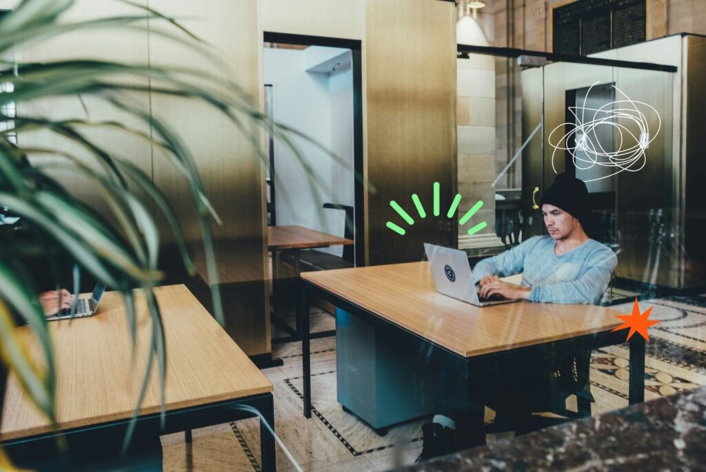 The image of a man sitting at a desk, as an example of the career coaching process