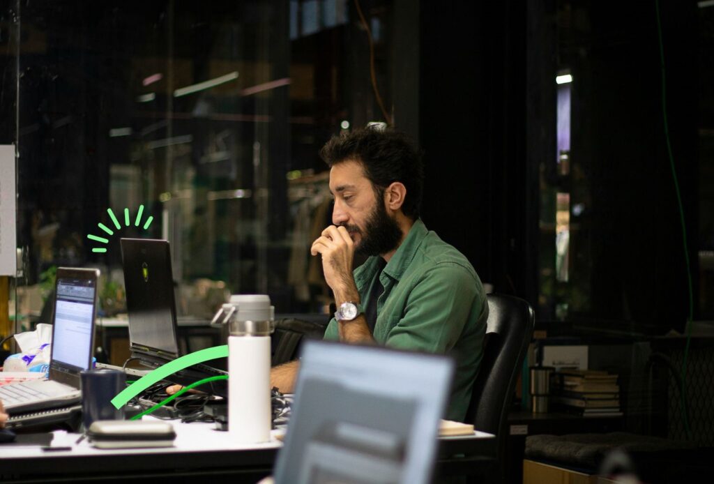 a picture of a man sitting at the desk and thinking